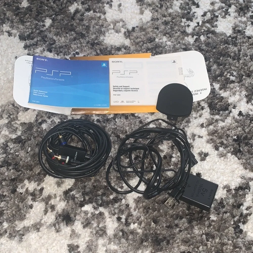 PSP Bundle with 7 games + case and extra disc holder and TV cables
